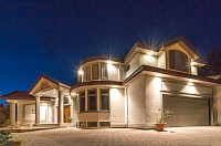 Beautiful home lit at night.  Credit to AREA title for image